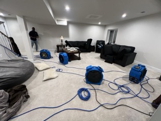 Commercial heat treatment equipment deployed in a room for complete bed bug elimination
